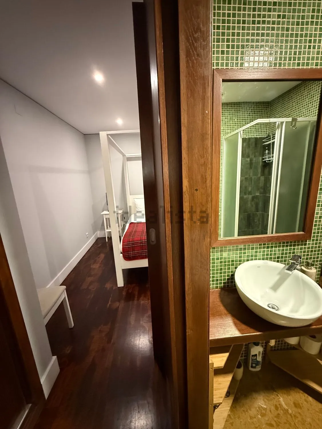 Bathroom with green tiles